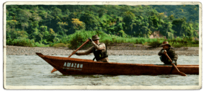 Two adventurers paddling down the Amazon during the Amazon Canoe Challenge, covered by travel social media agency Next Stop Adventures.